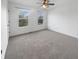 Bedroom with neutral walls, carpeted floors, and two windows to brighten the space with natural light at 6234 N Woods Edge Dr, McCordsville, IN 46055