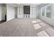 Large living room featuring custom built-in shelving and natural light at 6234 N Woods Edge Dr, McCordsville, IN 46055