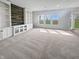 Spacious living room featuring lots of natural light and wall shelving at 6234 N Woods Edge Dr, McCordsville, IN 46055