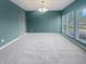 Bright living room with large windows and neutral carpet at 6234 N Woods Edge Dr, McCordsville, IN 46055