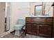 Cozy bathroom offering a wood vanity, sink and a shower at 6318 Dahlia Dr, Indianapolis, IN 46217
