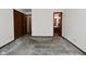 Carpeted bedroom with view into an en-suite bathroom and a closet at 6318 Dahlia Dr, Indianapolis, IN 46217