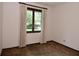 Bright bedroom featuring a window with natural light and views at 6318 Dahlia Dr, Indianapolis, IN 46217