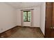 Cozy bedroom with a window, neutral walls, and plush carpeting at 6318 Dahlia Dr, Indianapolis, IN 46217