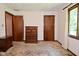 Bedroom with two wooden doors and furniture at 6318 Dahlia Dr, Indianapolis, IN 46217