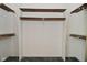 Empty closet featuring wood and white shelving at 6318 Dahlia Dr, Indianapolis, IN 46217