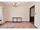 Neutral dining room with brown accents, featuring an antique table and a vintage chandelier at 6318 Dahlia Dr, Indianapolis, IN 46217