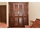 Laundry room with a side by side washer and dryer, and wood-paneled folding doors at 6318 Dahlia Dr, Indianapolis, IN 46217