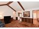 Spacious living room with wood accents, fireplace, and an opening to the dining room at 6318 Dahlia Dr, Indianapolis, IN 46217