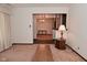 Spacious living area featuring classic decor and an open view to the dining room at 6318 Dahlia Dr, Indianapolis, IN 46217