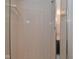 Shower displaying white tiled walls and sliding glass door at 6318 Dahlia Dr, Indianapolis, IN 46217