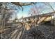 Backyard featuring a lush lawn, trees, and a house with a deck, creating a peaceful outdoor space at 664 N County Road 800 E, Avon, IN 46123