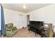 Cozy bedroom featuring carpet flooring, closet, olive chair, and a black piano at 664 N County Road 800 E, Avon, IN 46123