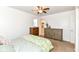 Bedroom with a ceiling fan, dressers, and a glimpse into the en-suite bathroom at 664 N County Road 800 E, Avon, IN 46123