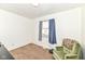 Bright bedroom with neutral carpet, sitting chair, and a large window at 664 N County Road 800 E, Avon, IN 46123