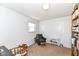 Bedroom featuring neutral carpet, reading chair, and built-in bookshelves at 664 N County Road 800 E, Avon, IN 46123