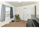 Bedroom featuring carpet, a chair, and a piano, creating a cozy space at 664 N County Road 800 E, Avon, IN 46123