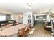Open concept dining area with wood floors, seamlessly connected to the living room and kitchen at 664 N County Road 800 E, Avon, IN 46123
