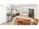 Bright dining area with rustic wood flooring and a sliding glass door to the backyard at 664 N County Road 800 E, Avon, IN 46123