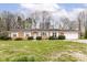 Charming single story brick home with attached garage and mature trees at 664 N County Road 800 E, Avon, IN 46123