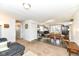 Spacious living room features carpet and hardwood flooring with a view to the dining area at 664 N County Road 800 E, Avon, IN 46123