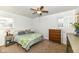 Bright main bedroom featuring neutral tones, ceiling fan and a cozy bed at 664 N County Road 800 E, Avon, IN 46123