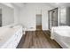 Bright bathroom with double sink vanity, walk-in shower, and a soaking tub for relaxation at 6915 Juliet Dr, Avon, IN 46123