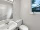 A clean half bath featuring a white sink and toilet at 6915 Juliet Dr, Avon, IN 46123