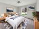 Comfortable bedroom with modern decor, soft carpet, and large window bringing in natural light at 6915 Juliet Dr, Avon, IN 46123