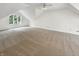 Large bonus room with vaulted ceilings and dormer window, offers versatile living space at 6915 Juliet Dr, Avon, IN 46123