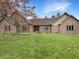 Charming brick home featuring a well-manicured lawn and a beautifully landscaped front yard at 6915 Juliet Dr, Avon, IN 46123