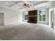 Bright living room with coffered ceilings, neutral carpeting, and a brick fireplace at 6915 Juliet Dr, Avon, IN 46123