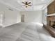 Open living room with neutral paint, plush carpet, fireplace, and plenty of room to relax at 6915 Juliet Dr, Avon, IN 46123