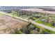 Aerial view of homes and a two-lane highway near an open field at 7008 E Jackson St, Muncie, IN 47303