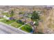 Aerial view featuring homes with lush lawns and mature trees, and a view of a highway at 7008 E Jackson St, Muncie, IN 47303