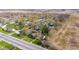Aerial view of a neighborhood with many trees and a two-lane highway at 7008 E Jackson St, Muncie, IN 47303