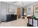 Bedroom with a crib, dresser, and cozy armchair at 7008 E Jackson St, Muncie, IN 47303