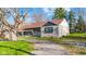 Exterior elevation of single story home with stone facade and covered porch at 7008 E Jackson St, Muncie, IN 47303