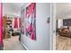 Hallway with wall decorations, leading to the living room and other areas of the home at 7008 E Jackson St, Muncie, IN 47303