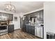 Spacious kitchen featuring dark cabinets, stainless steel appliances, and a modern light fixture at 7008 E Jackson St, Muncie, IN 47303