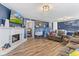 Inviting living room showcasing the fireplace and laminate wood-look flooring at 7008 E Jackson St, Muncie, IN 47303