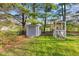 Backyard with a storage shed and chicken coop at 7008 E Jackson St, Muncie, IN 47303