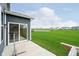 A large backyard featuring a view of the pond and a sliding glass door at 7158 Sugar Maple Ln, Brownsburg, IN 46112