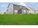 Spacious backyard with green grass and a view of the home's exterior at 7158 Sugar Maple Ln, Brownsburg, IN 46112