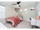 This bedroom has a ceiling fan, bed, desk, and large window for natural light at 7158 Sugar Maple Ln, Brownsburg, IN 46112