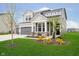 Charming two-story home with gray siding, well-kept lawn, and lovely curb appeal at 7158 Sugar Maple Ln, Brownsburg, IN 46112