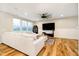 Spacious living room with a large sectional sofa and a stylish ceiling fan at 7158 Sugar Maple Ln, Brownsburg, IN 46112