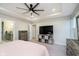 This main bedroom features a tray ceiling, fan, tv, ensuite, and walk-in closet at 7158 Sugar Maple Ln, Brownsburg, IN 46112