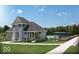 Community pool house with outdoor pool and lounge area at 7288 Broadview Ln, McCordsville, IN 46055