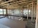 Living room with a wall of windows, framed walls, and a stylish ceiling, offering abundant natural light at 778 Oakleaf Dr, Greenfield, IN 46140